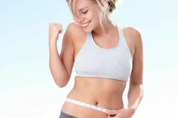 woman happy after fat reduction treatment Peterborough